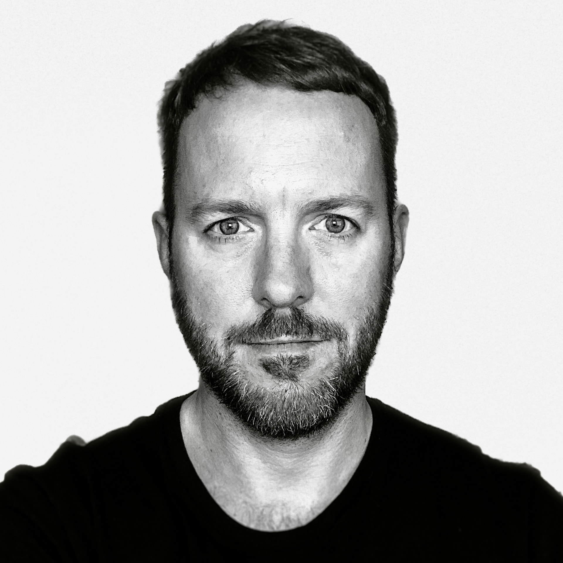 Black-and-white portrait of Barry Clark-Ewers